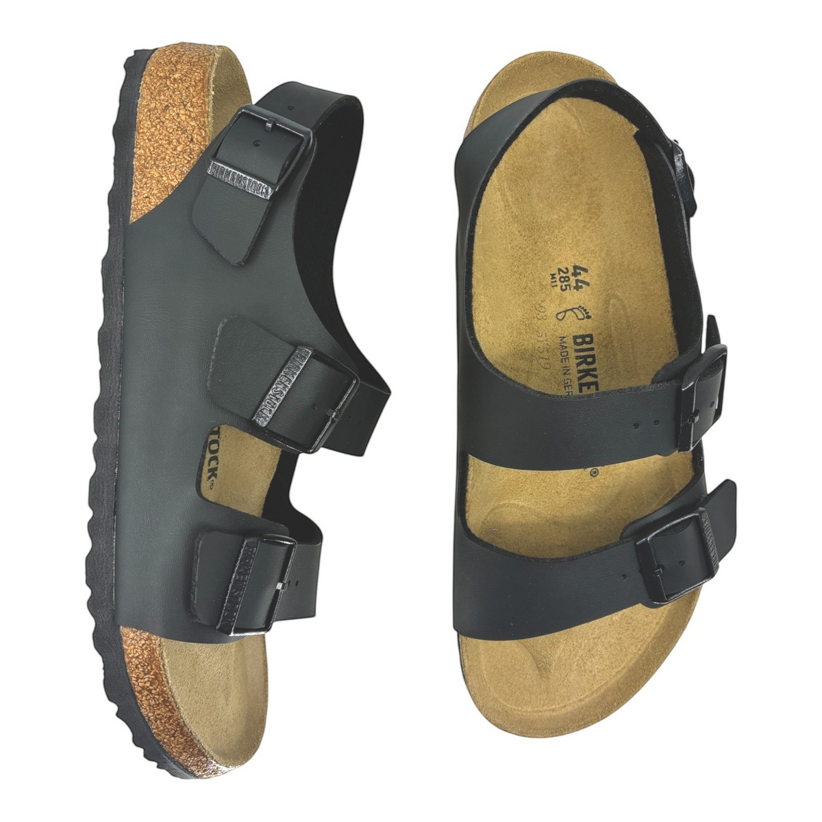 The Shoe Shop Milano black Birko-Flor sandals with cork-latex footbed, back-strap, and adjustable metal buckles.