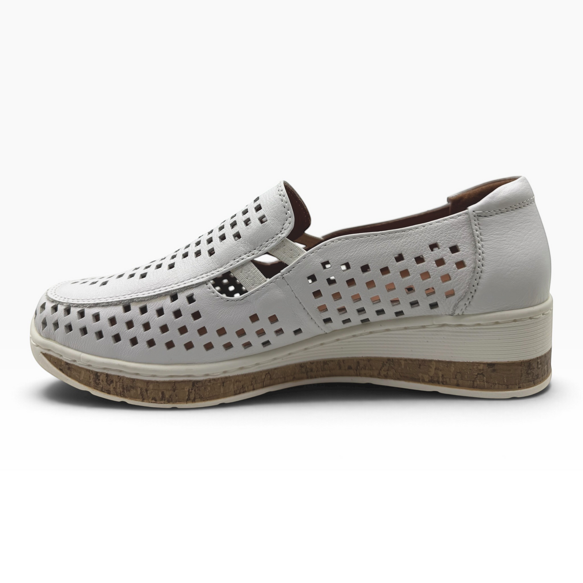 The Shoe Shop Monkey casual white leather slip-on shoe with laser-cut detailing and a comfortable cork-effect sole.