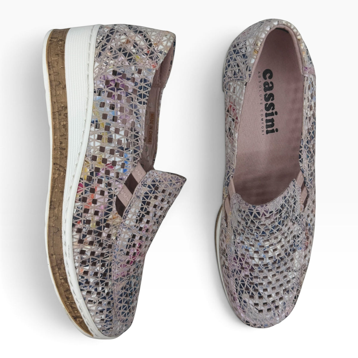 The Shoe Shop Monkey casual slip-on shoes featuring a cream geometric woven pattern and a cork-effect wedge sole.