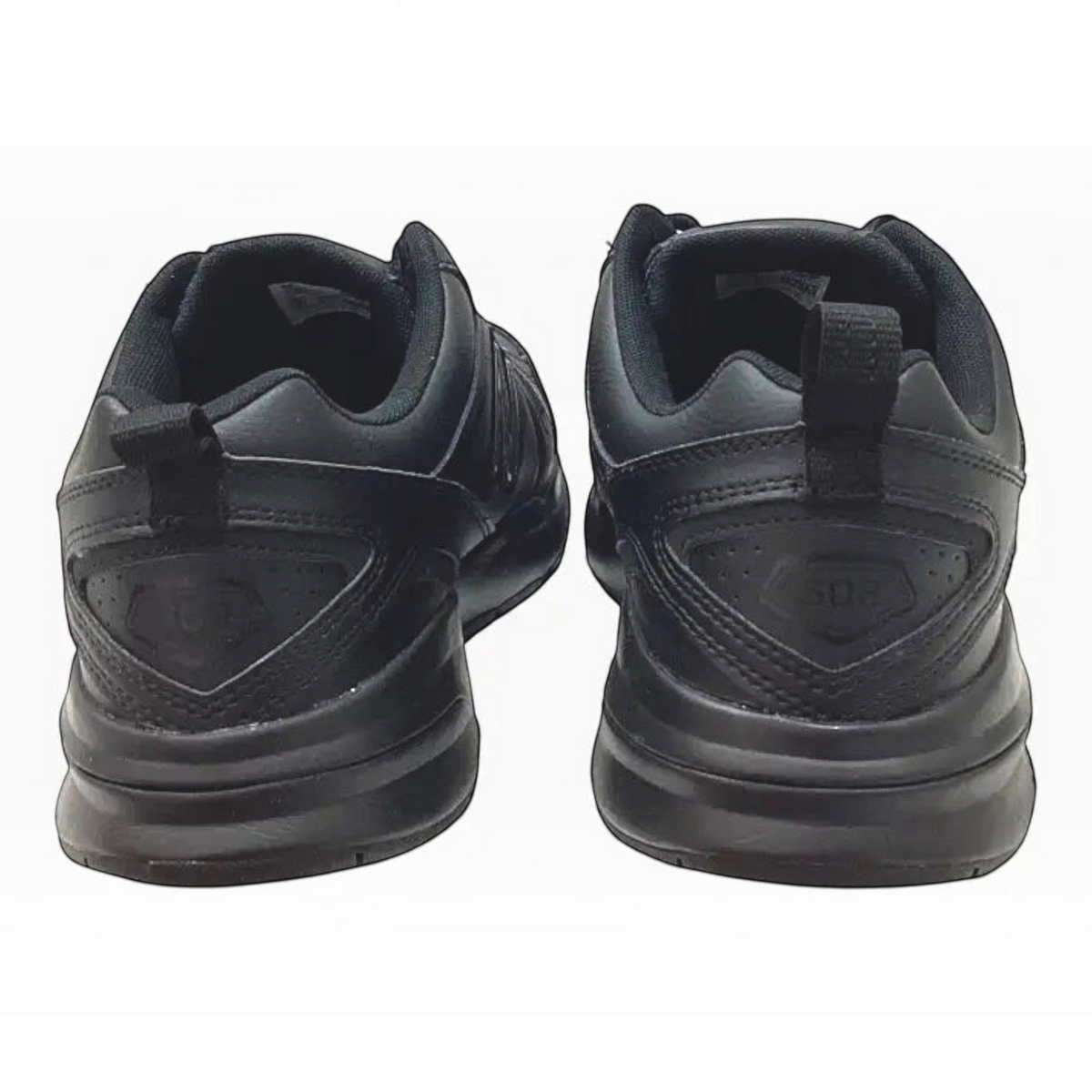 The Shoe Shop MX608V5 4E extra wide black leather sneakers shown from the back, highlighting the durable rubber outsole.