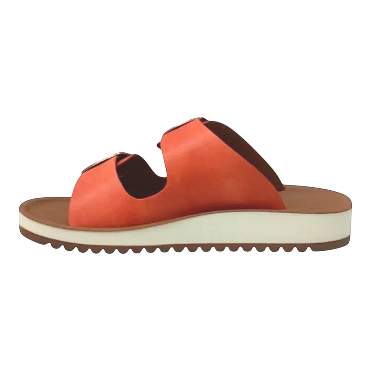 The Shoe Shop Naara slide in burnt orange vegan leather with double adjustable buckles and a white low wedge sole.