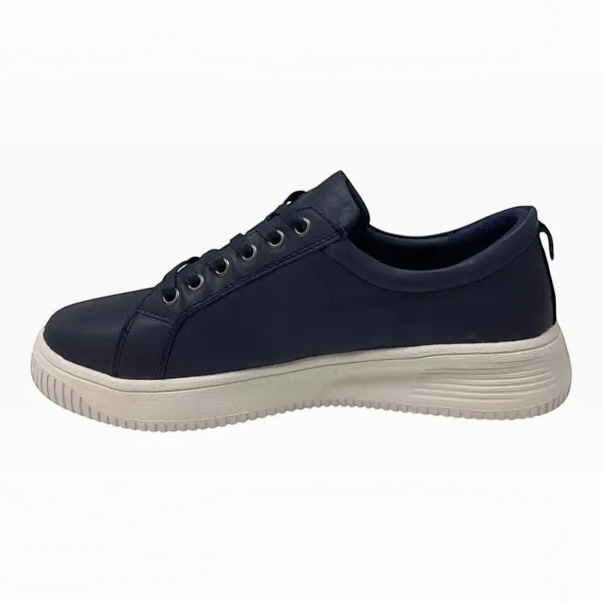 The Shoe Shop Naked Arches Nelly navy leather sneaker with a white platform midsole and lace-up design.