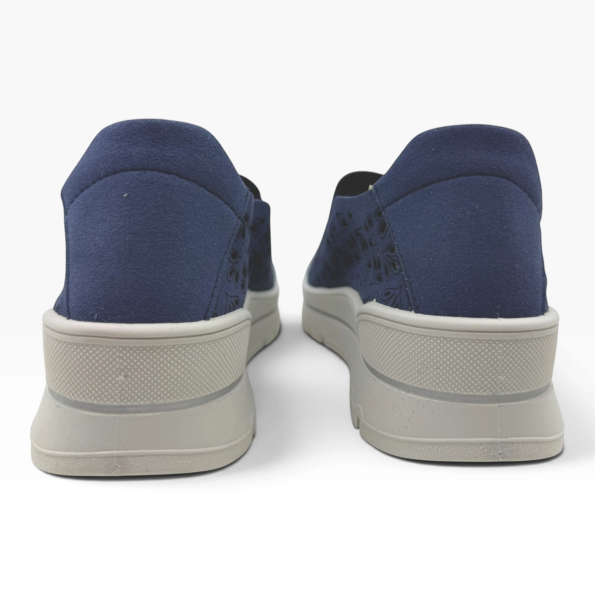 The Shoe Shop A40042 casual navy blue flats with laser-cut detailing and a thick grey platform sole, rear view.