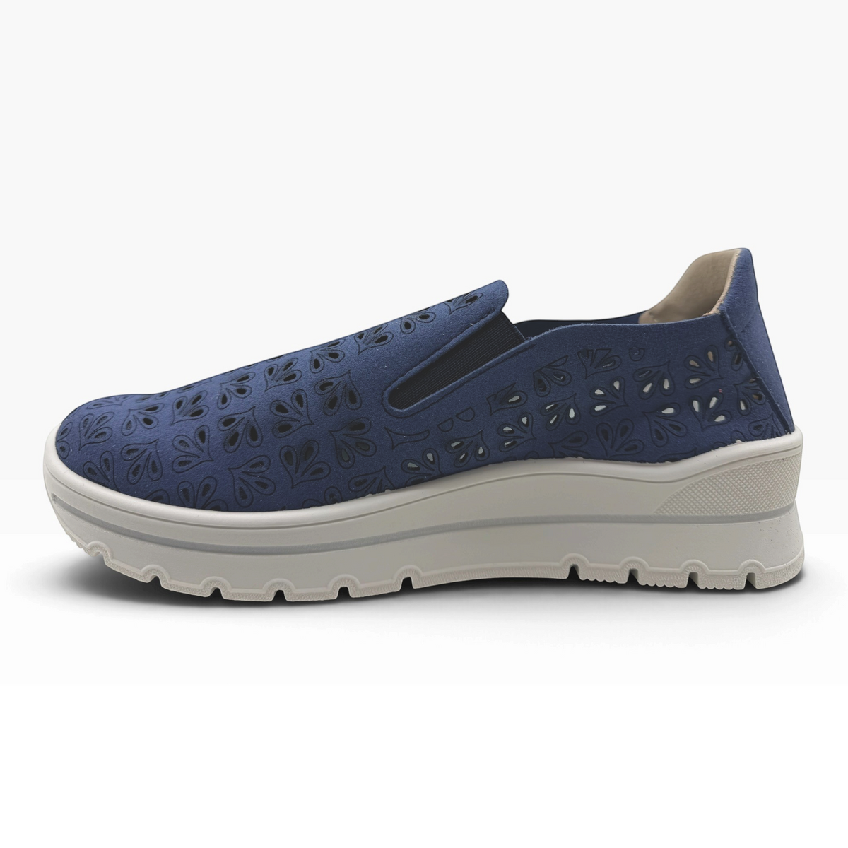 The Shoe Shop A40042 casual flat in navy blue with laser-cut floral patterns and a thick white platform sole.
