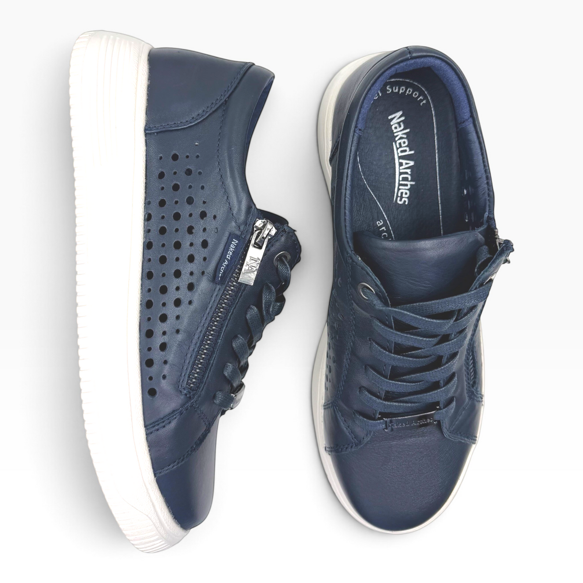 The Shoe Shop Naked Arches Noble navy leather sneakers with side zip, lace-up front, and perforated detailing.