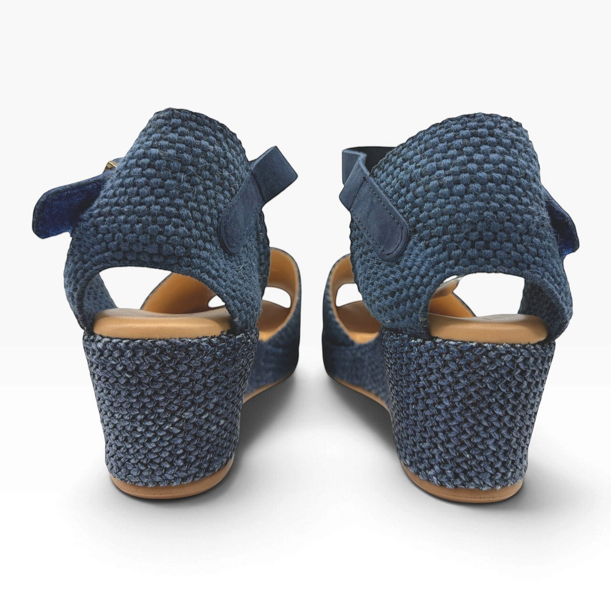 The Shoe Shop 11260 Pitillos navy blue woven wedge sandals with an adjustable ankle strap and tan cushioned insole.