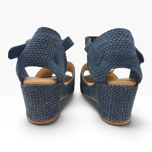 The Shoe Shop 11260 Pitillos navy blue woven wedge sandals with an adjustable ankle strap and tan cushioned insole.