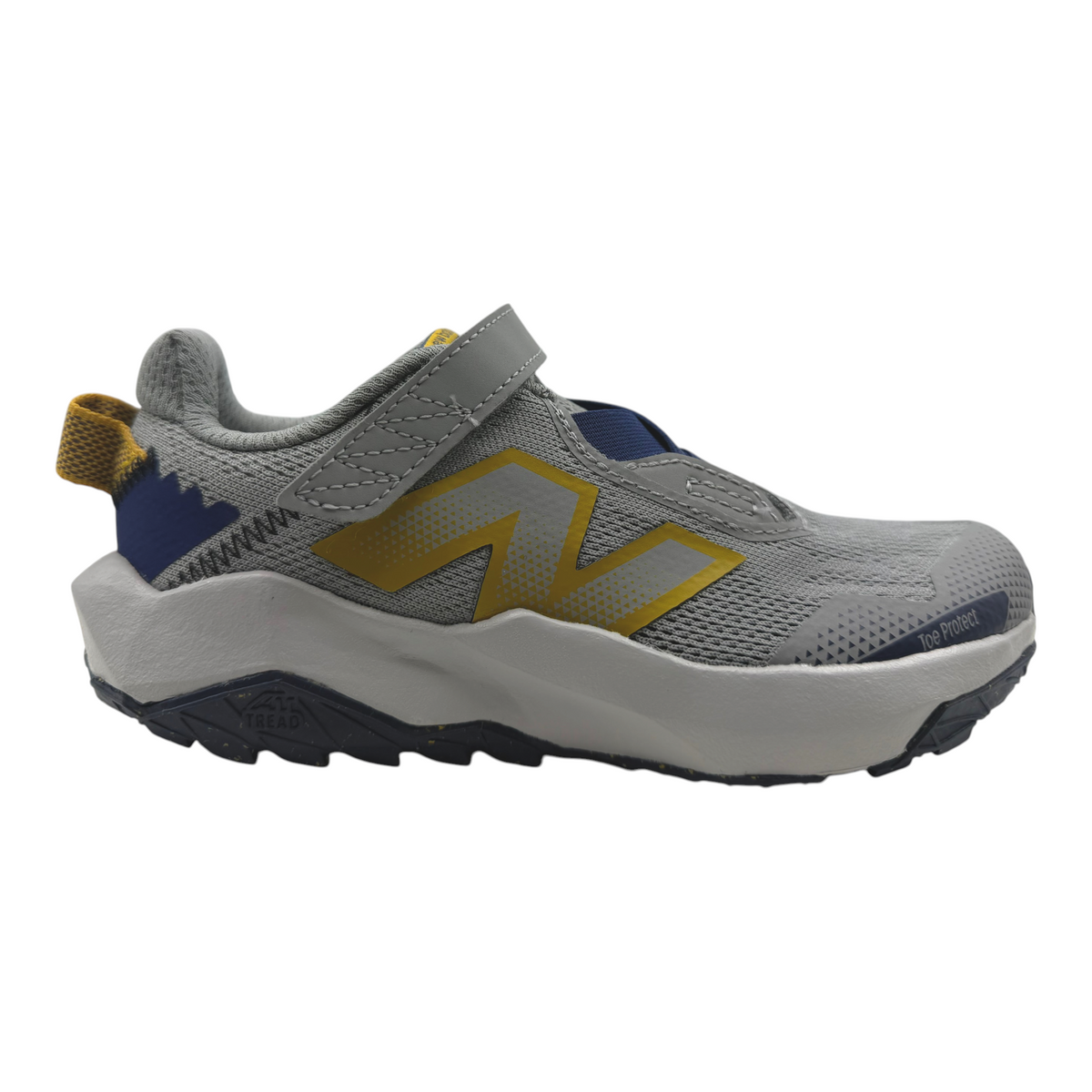 The Shoe Shop Nitrel v6 kids trail sneaker in grey with yellow logo, hook-and-loop strap, and rugged traction outsole.