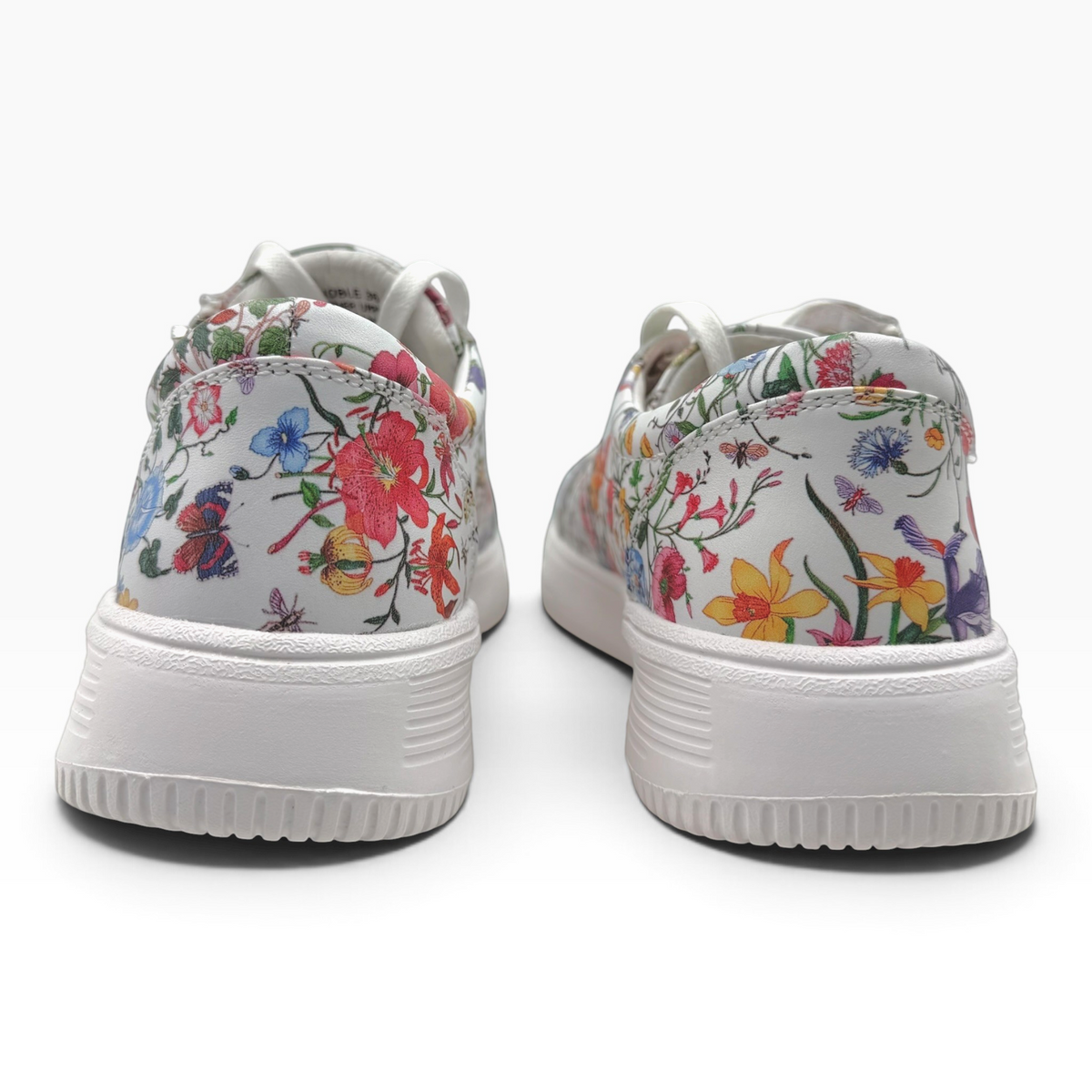 The Shoe Shop Noble sneakers featuring a white leather upper with a vibrant floral print and a white platform sole.