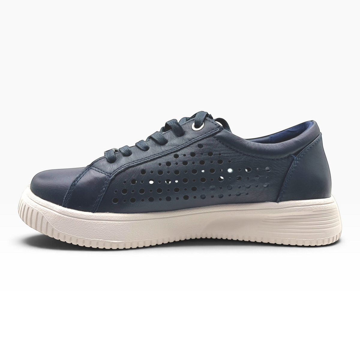 The Shoe Shop Noble navy leather sneaker with punch-hole detailing, lace-up front, and a white platform sole.