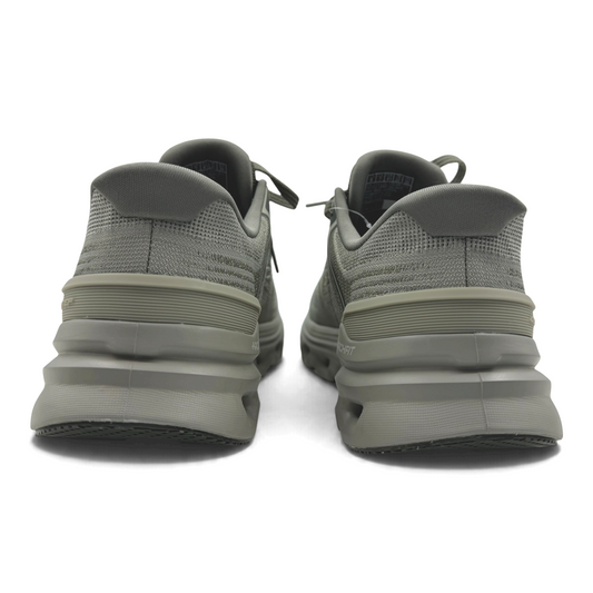 The Shoe Shop Go Run Glide Step sneakers in olive green, showing the rear view of the geometric midsole and heel.