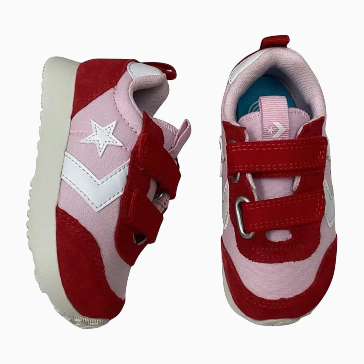 The Shoe Shop Omega Trainer infant sneakers in pink and red suede with white star logo and dual hook-and-loop straps.