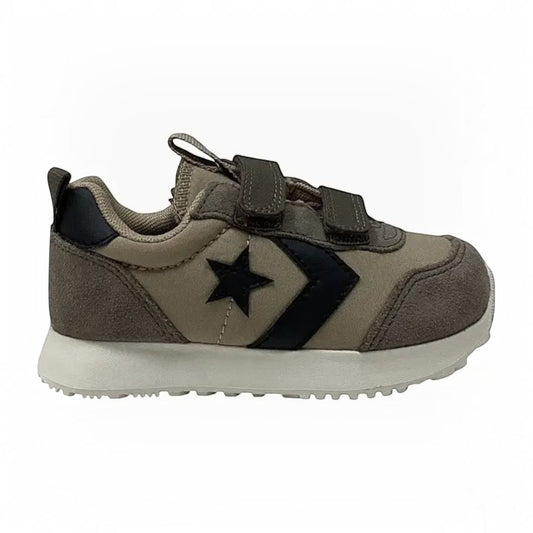 The Shoe Shop Omega infant trainer in taupe suede with black star logo and convenient double hook-and-loop straps