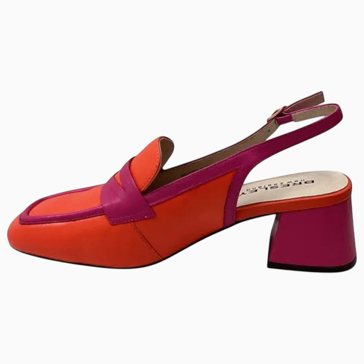 The Shoe Shop Peony slingback shoe in vibrant orange and pink leather with a block heel and buckle strap.