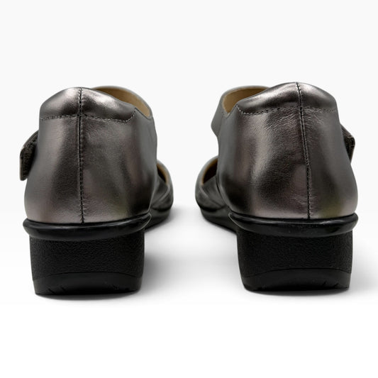 The Shoe Shop Osaka metallic silver leather shoes with a low black heel, shown from a rear view.