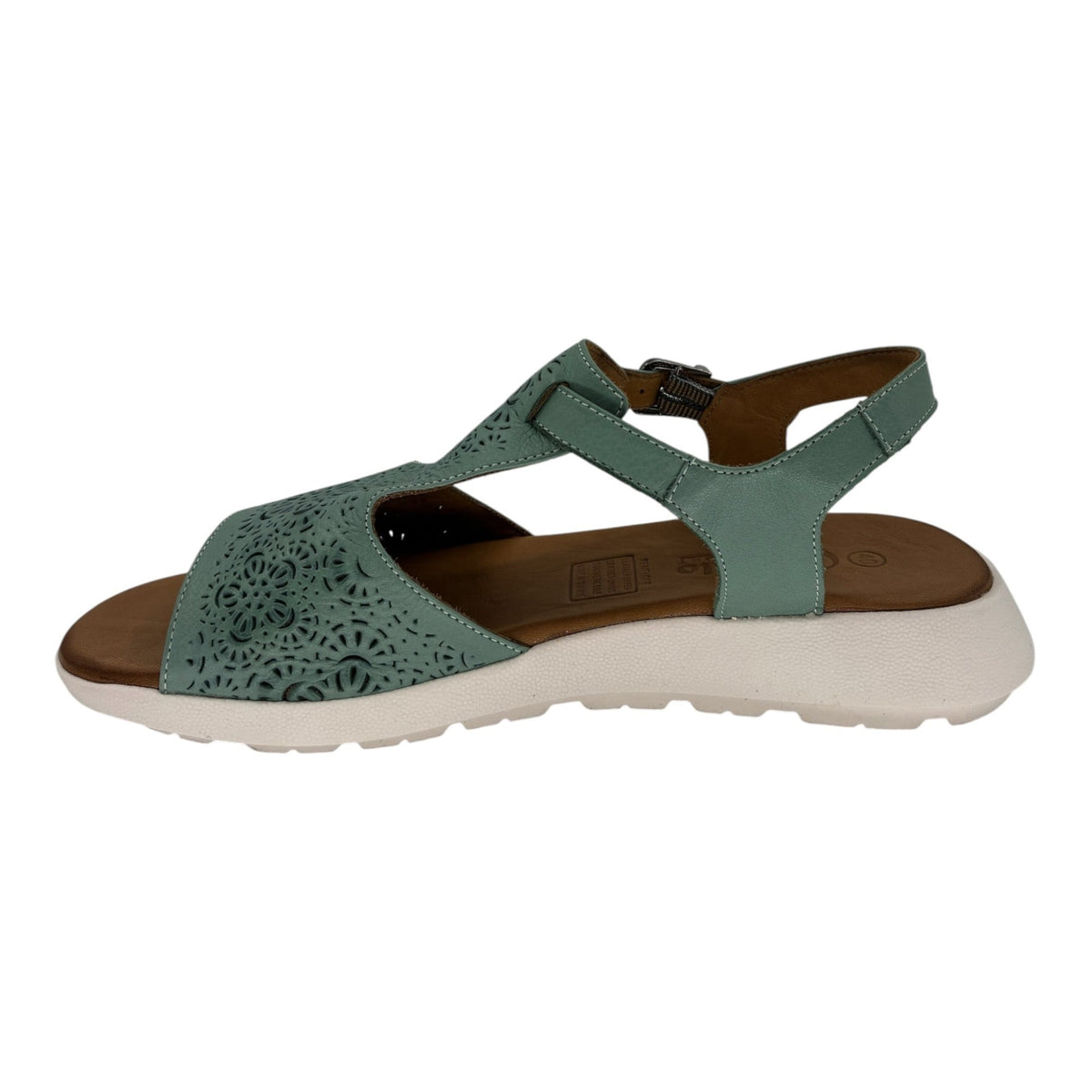 The Shoe Shop Penelope mint green leather sandal with laser-cut floral patterns, adjustable strap, and wedge sole.