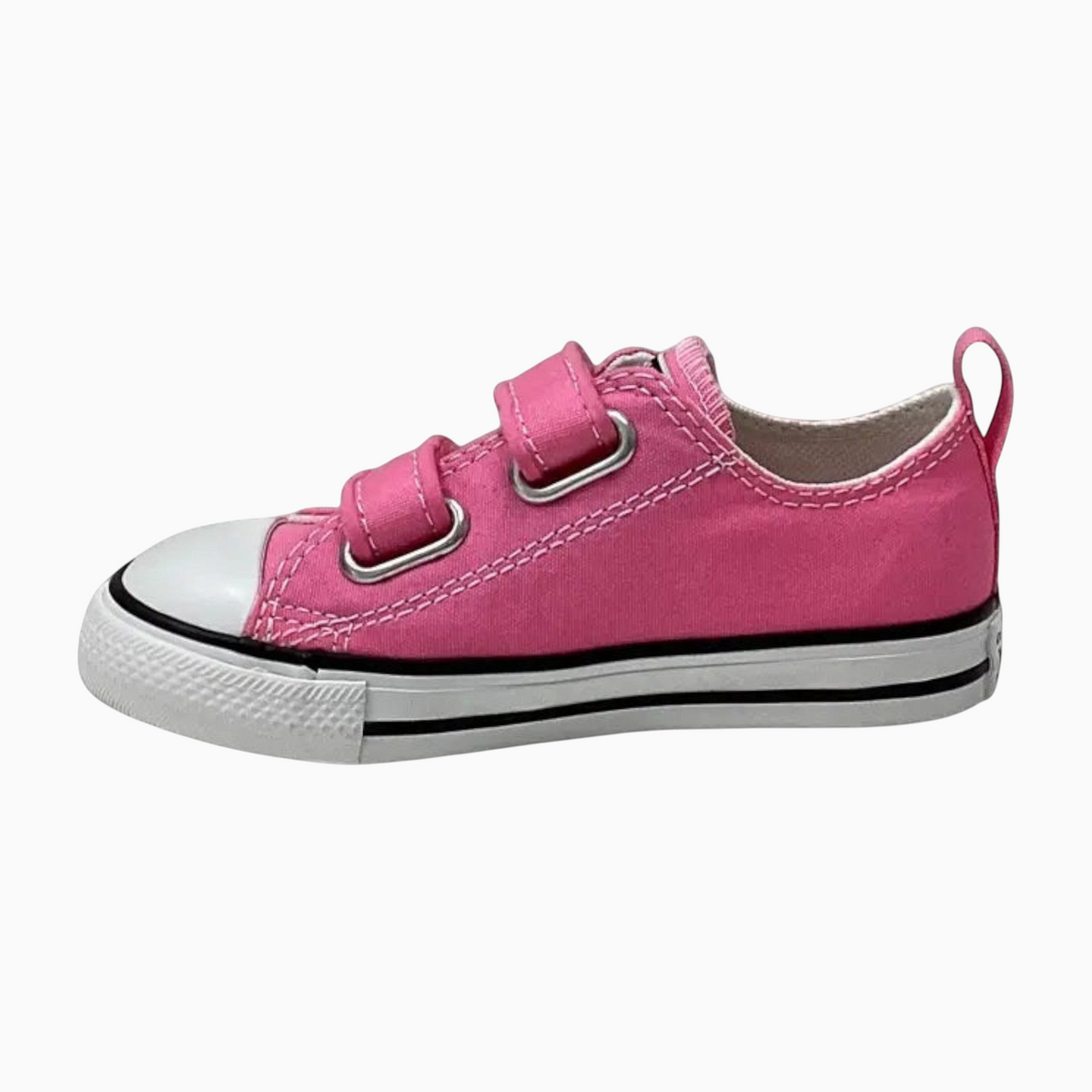 The Shoe Shop pink canvas infant low-top sneaker with two hook-and-loop straps and a white rubber toe cap.