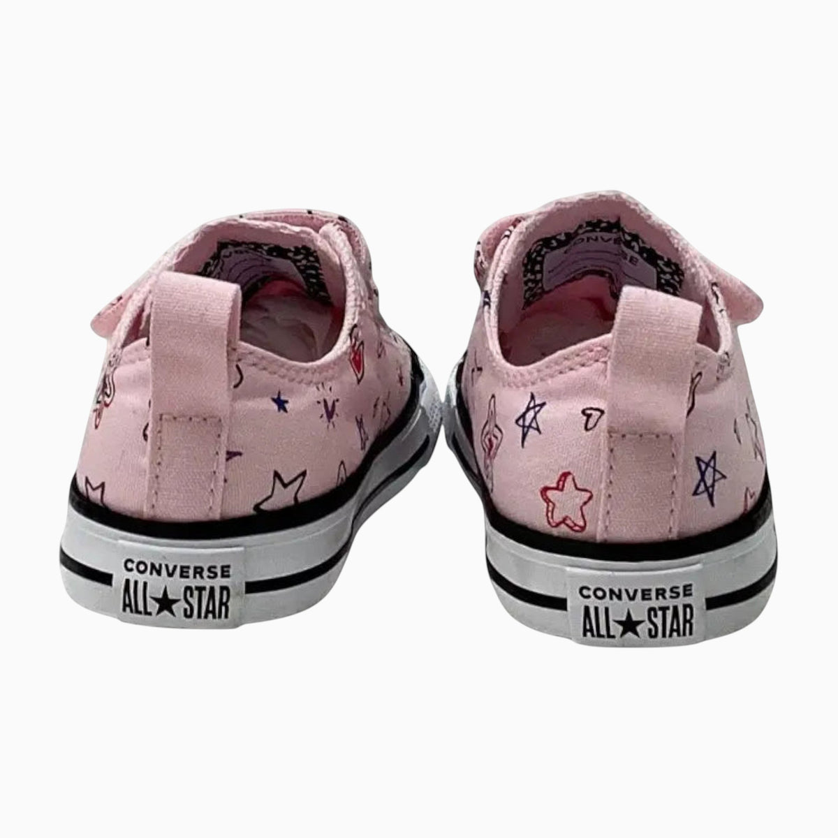 The Shoe Shop pink canvas Chuck Taylor All Stars with hand-drawn star and heart doodles and heel pull tabs