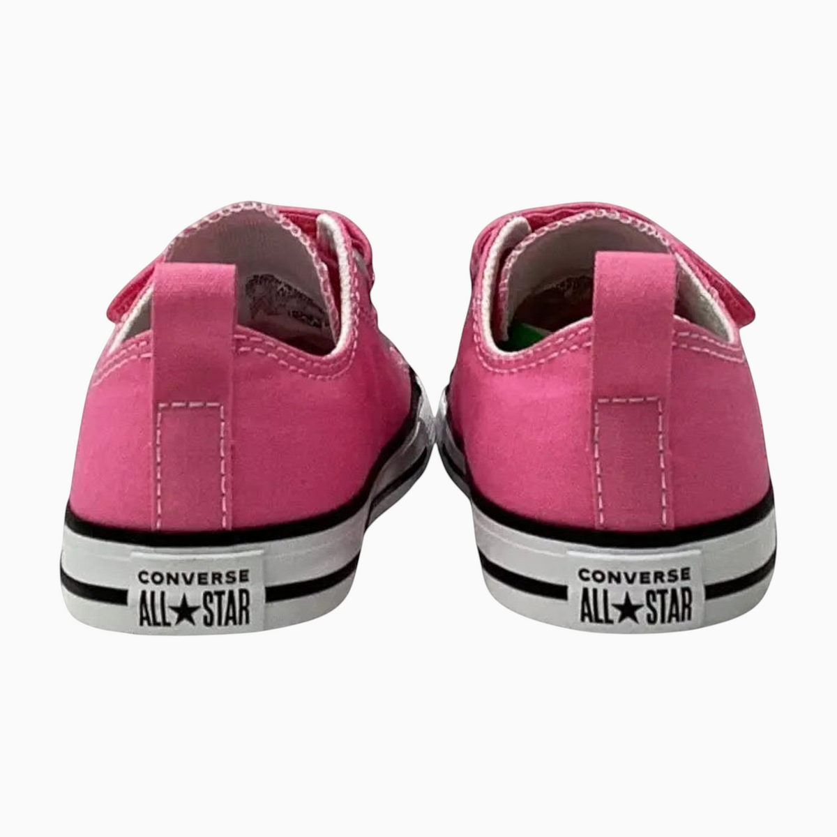 The Shoe Shop pink canvas infant Chuck Taylor All Star low top sneakers with heel pull tabs and rubber soles