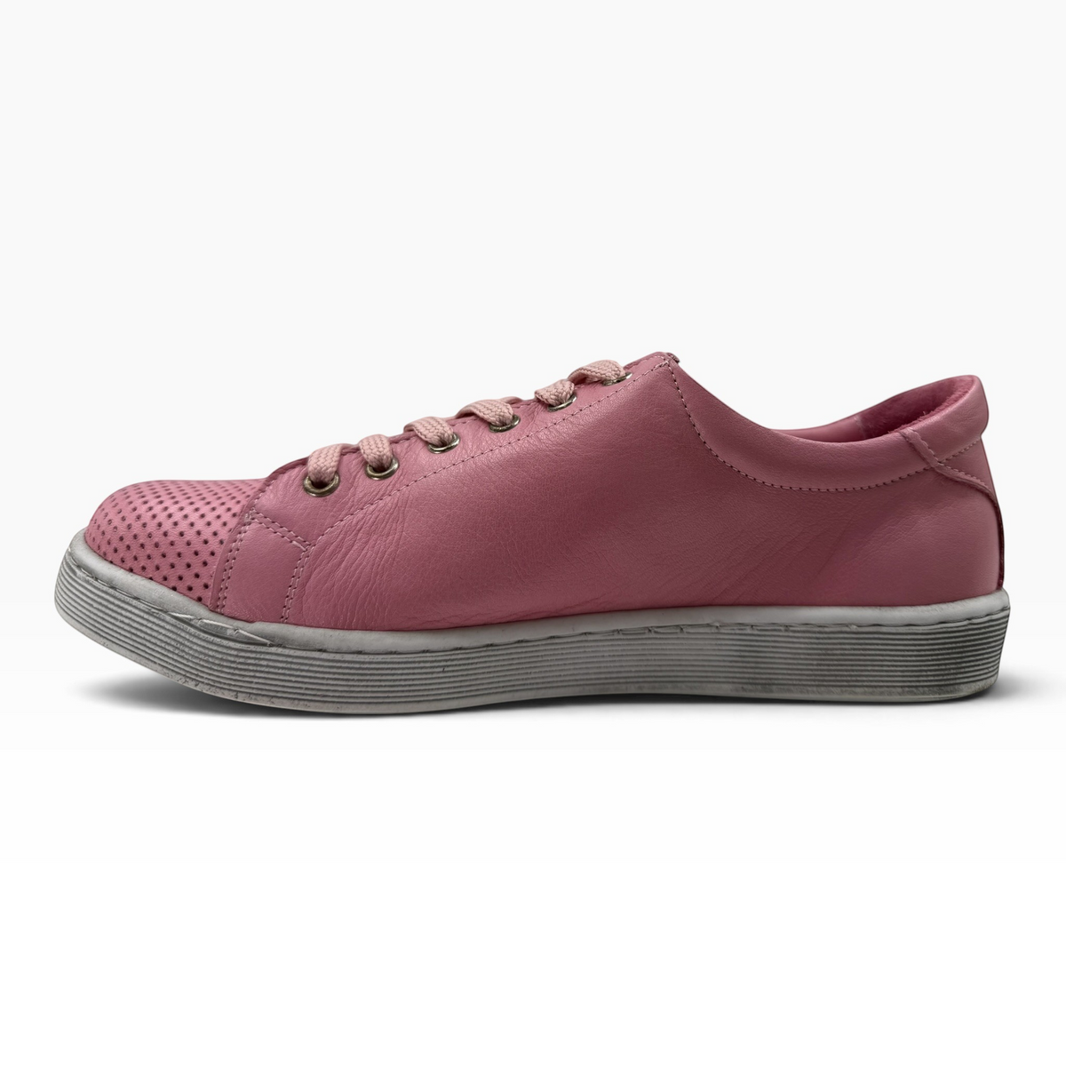 The Shoe Shop Tommie Perf pink leather sneaker with perforated toe detail, lace-up closure, and rubber sole.