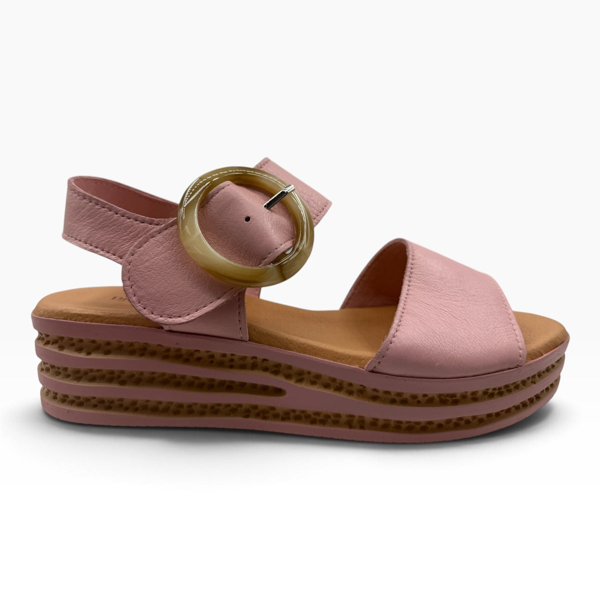 The Shoe Shop Cubbie pink leather platform sandal with a large round buckle and textured wedge sole
