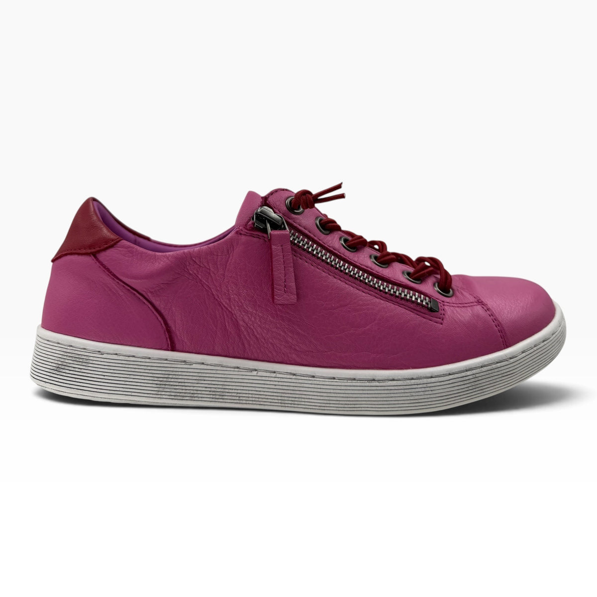 The Shoe Shop Rilassare Temi pink leather sneaker with side zip, elastic laces, and a white durable PU sole.