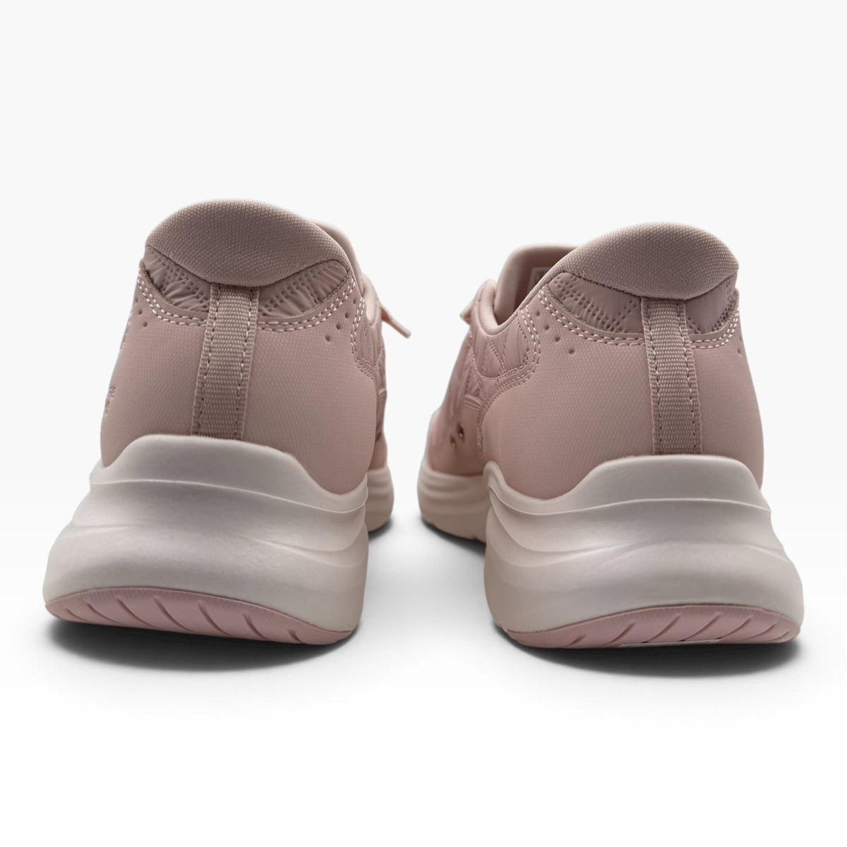 The Shoe Shop pink quilted slip-on sneakers with Heel Pillow technology and cushioned midsoles, rear view.