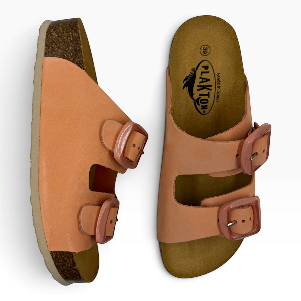 The Shoe Shop Plakton slide sandals in peach leather with double buckles and a contoured cork platform footbed.