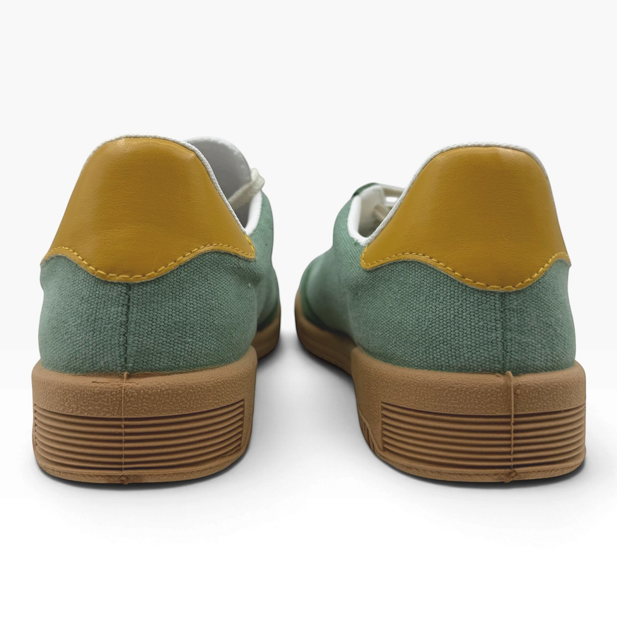 The Shoe Shop P35015 Pluma Flex green canvas sneakers with mustard yellow heel tabs and textured gum rubber soles