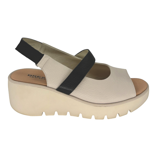 The Shoe Shop Pollen wedge sandal in cream and black leather with a cushioned sole and adjustable velcro back strap.