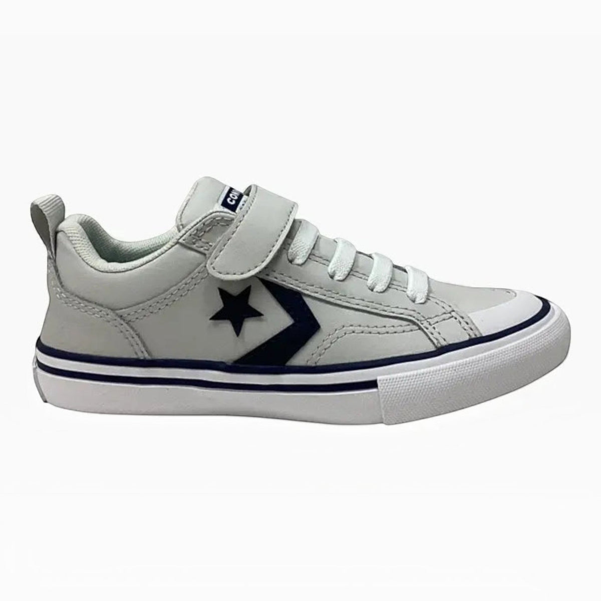 The Shoe Shop Pro Blaze Strap white leather sneakers with navy blue star logo, adjustable strap, and foam cushioning.