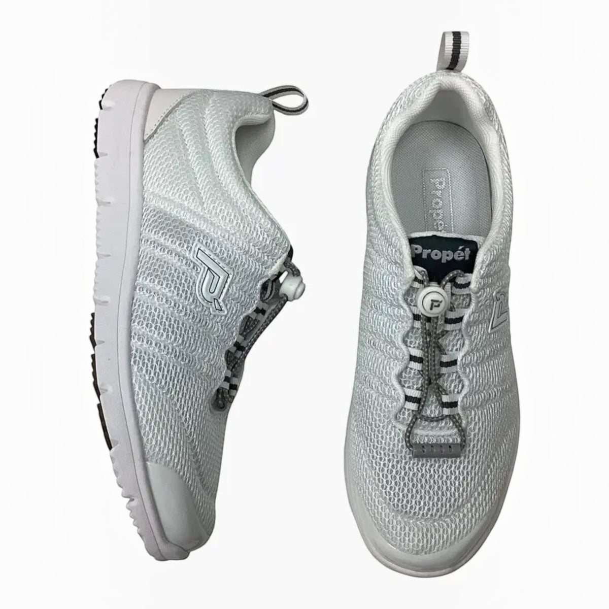 The Shoe Shop Propet Travel Walker white breathable mesh walking shoe with bungee toggle closure and cushioned sole.