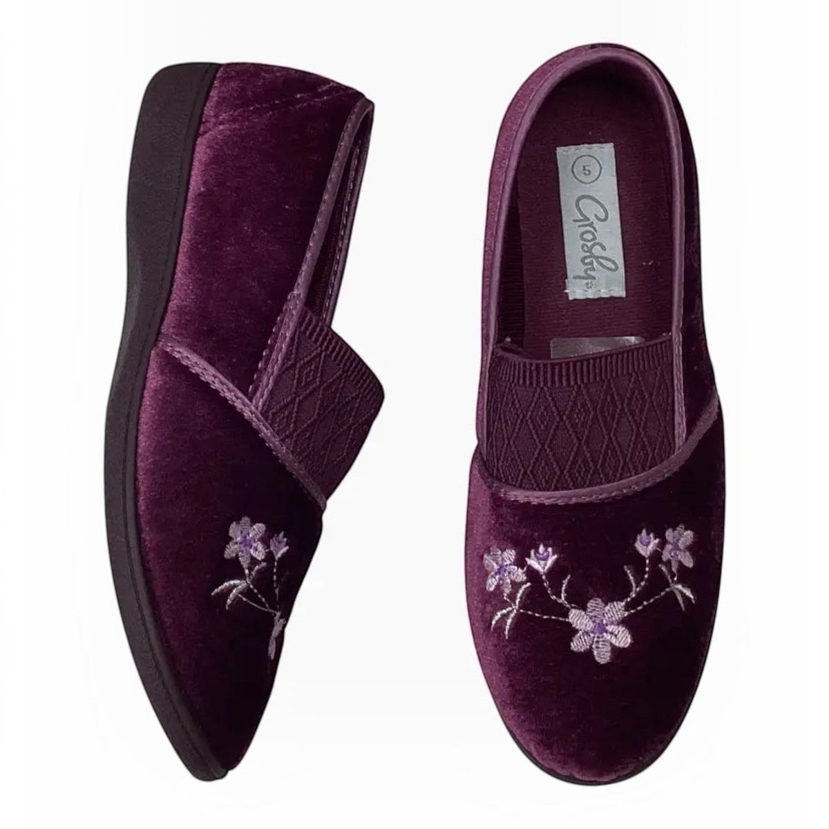 The Shoe Shop Grosby Sasha purple velvet slippers with floral embroidery and a low-profile black indoor sole.