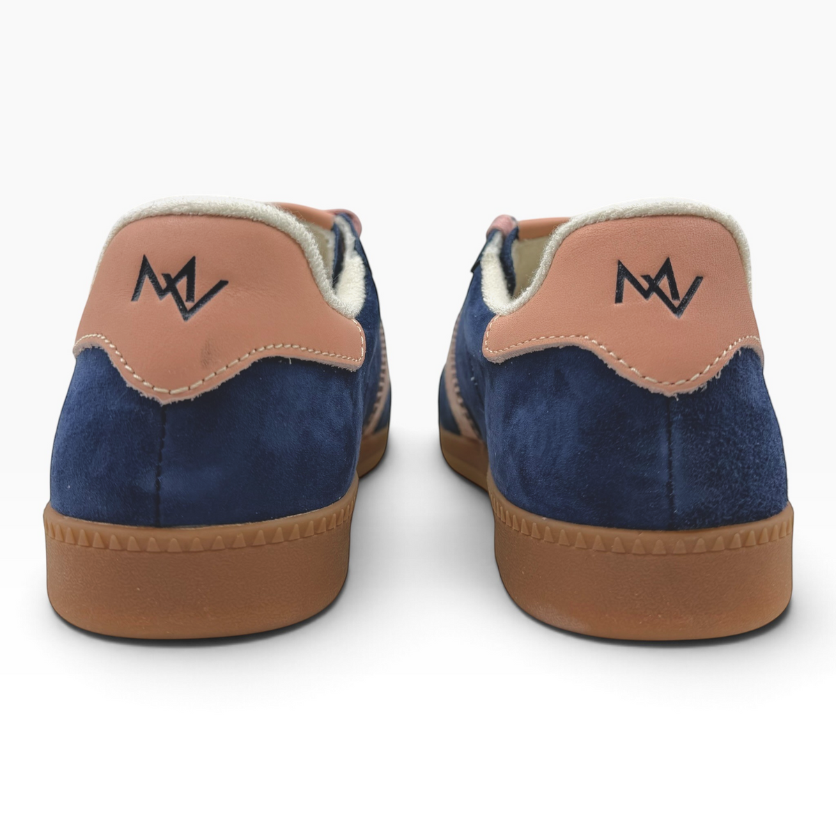 The Shoe Shop Ramona II navy suede sneakers with tan leather heel tabs and gum rubber soles, rear view.