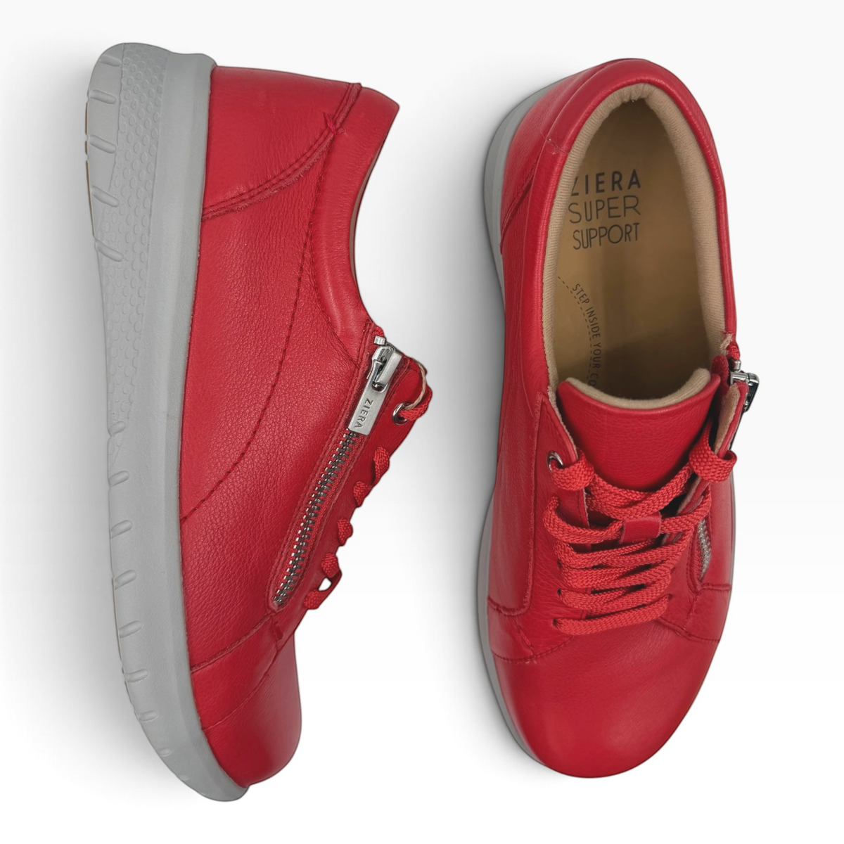 The Shoe Shop Ziera Solar XF red leather sneakers with side zip, lace-up closure, and grey slip-resistant sole.