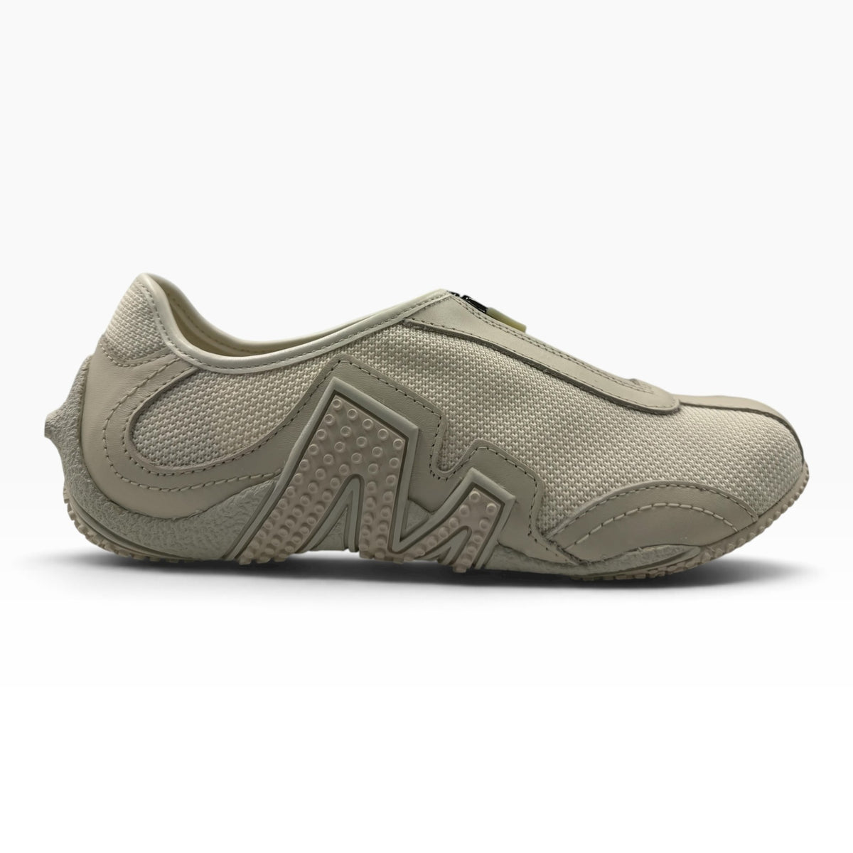 The Shoe Shop Relay Fly Zip sneaker in stucco beige featuring a mesh upper and textured geometric side detailing.