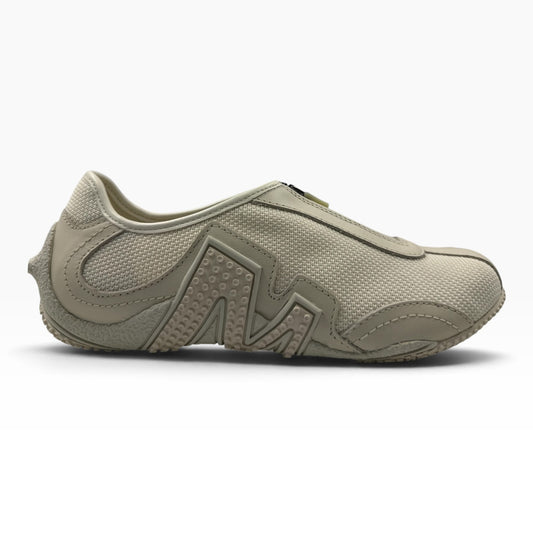 The Shoe Shop Relay Fly Zip sneaker in stucco beige featuring a mesh upper and textured geometric side detailing.