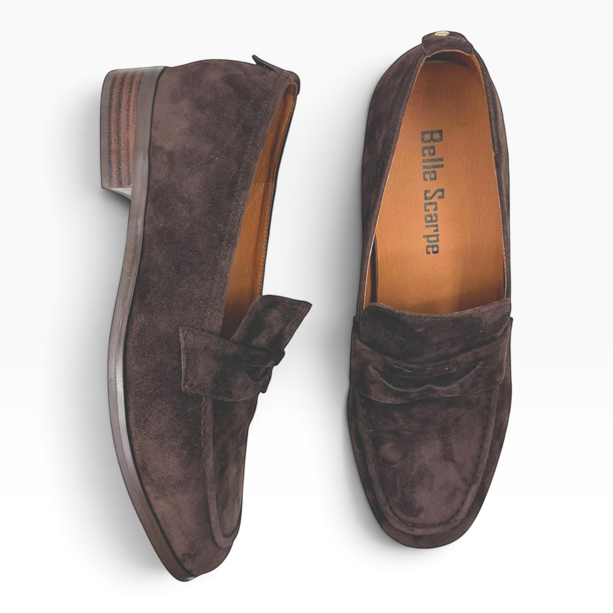 The Shoe Shop Rika Loafer in dark brown suede with a classic silhouette, low stacked heel, and stitched detailing.