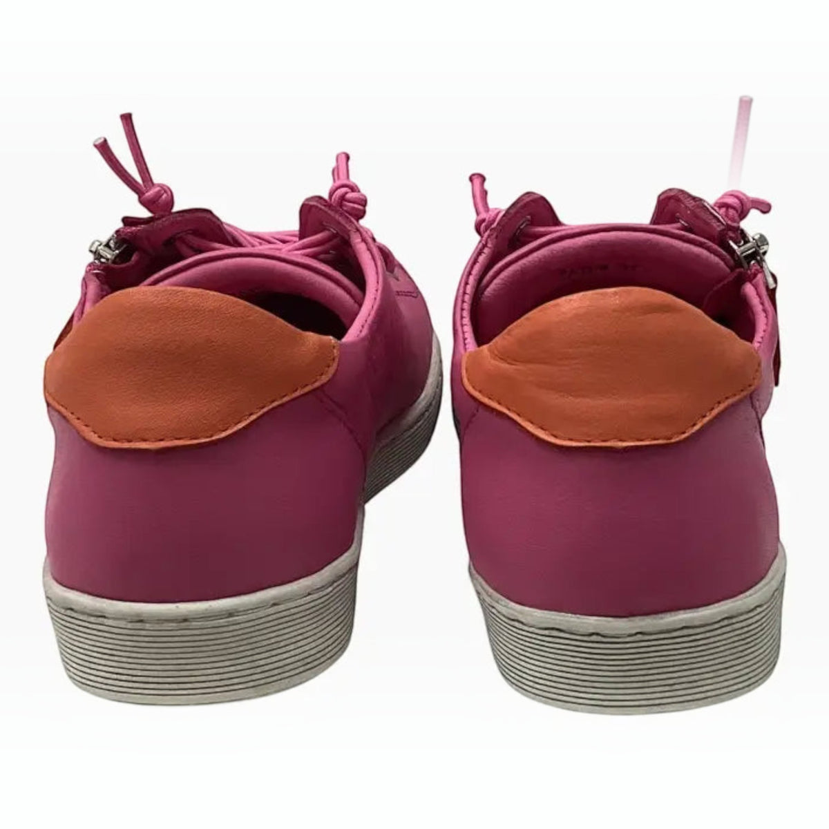 The Shoe Shop Rilassare Tatum pink leather sneakers with orange heel tabs and white platform soles, rear view.