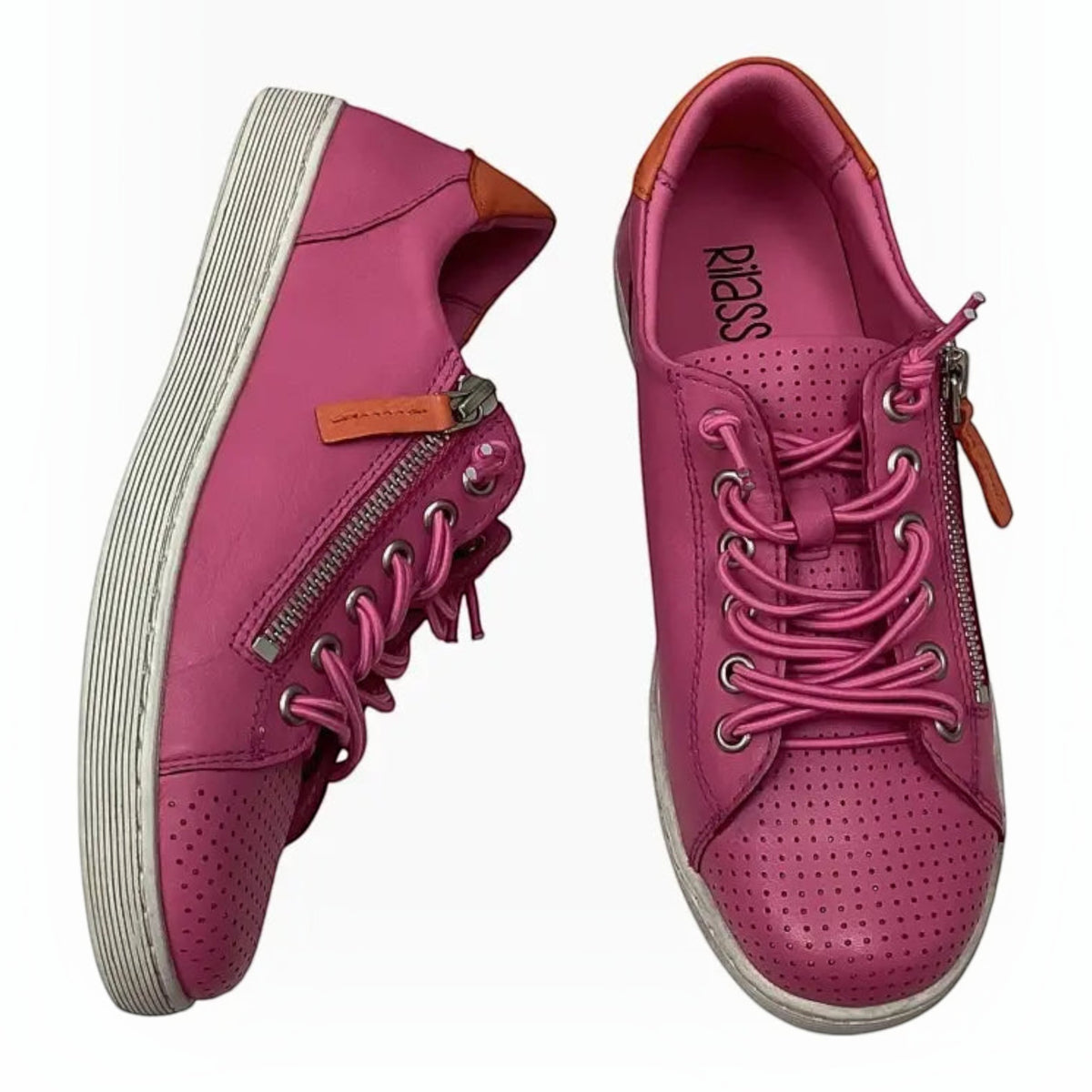 The Shoe Shop Rilassare Tatum pink leather sneakers with perforated toe, side zip, and white platform sole.