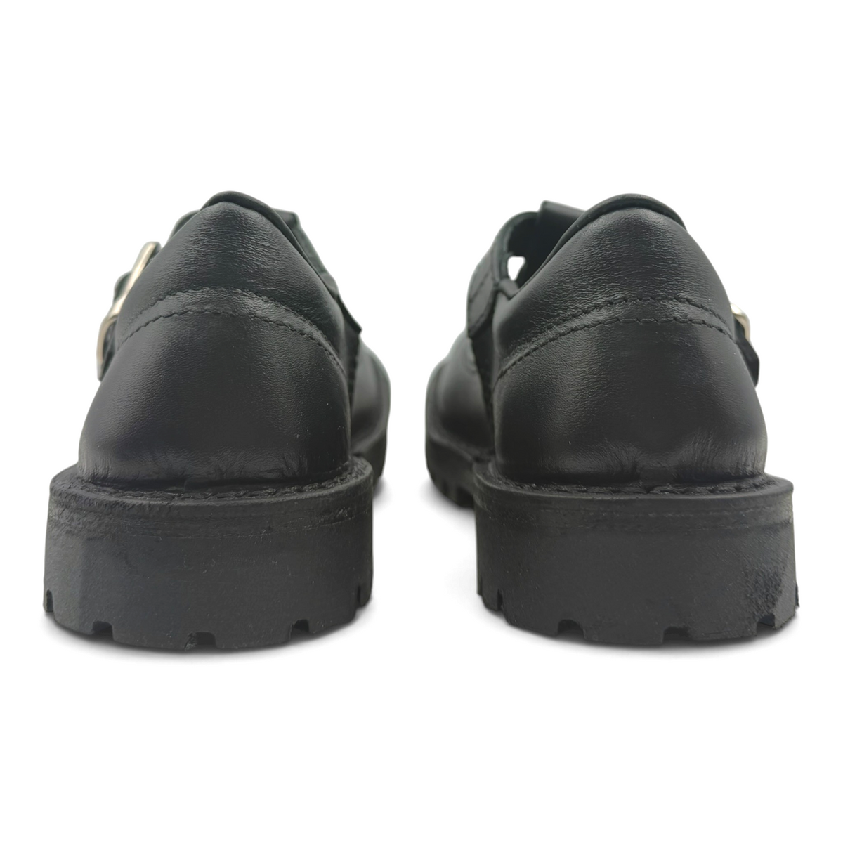 The Shoe Shop Rio black leather T-bar school shoes with durable rubber outsoles, viewed from the back.