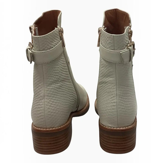 The Shoe Shop Ripper ankle boots in off-white leather with textured heel panels, back straps, and stacked heels.