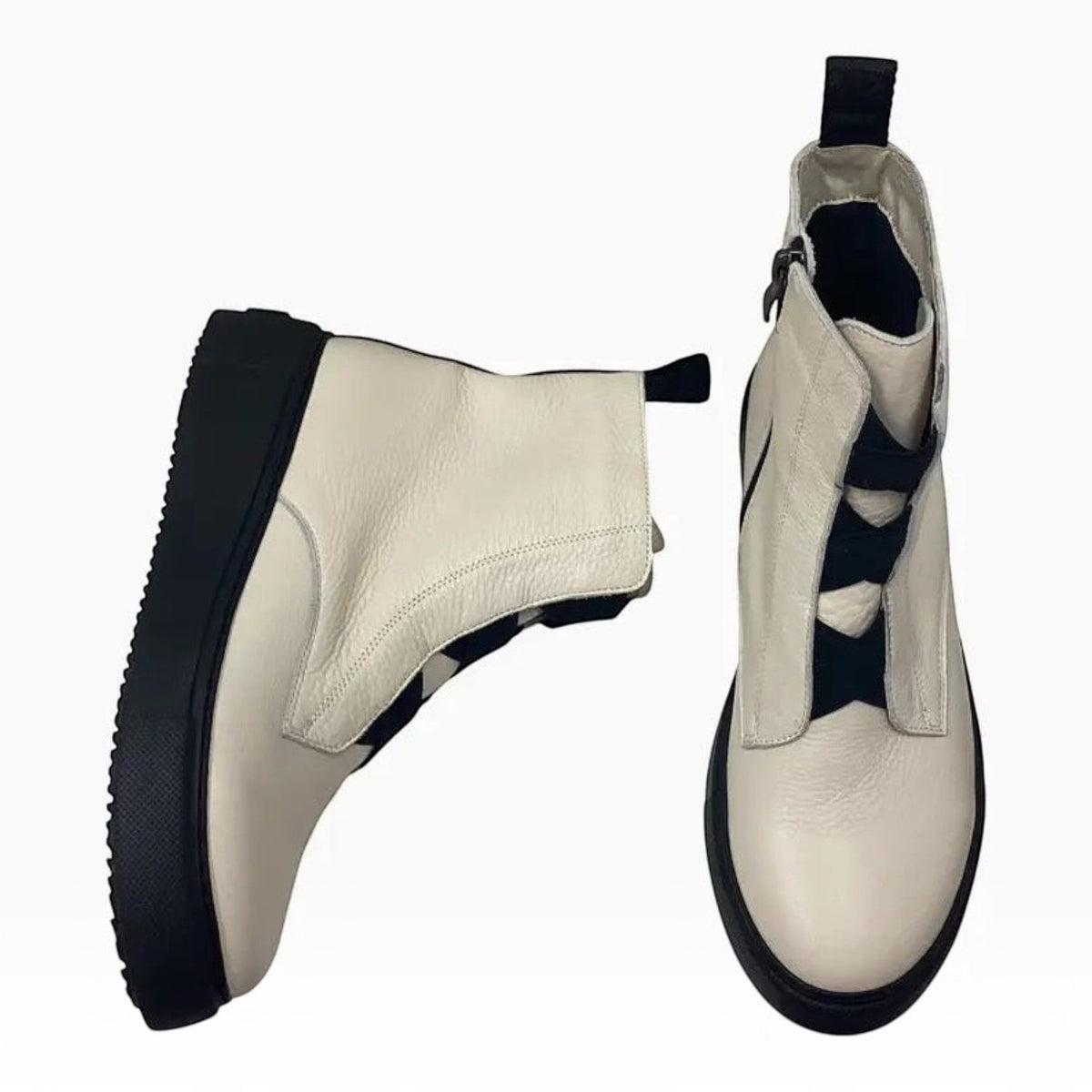 The Shoe Shop Robyn ankle boots in cream leather with a black sole and fluffy lining, shown from side and front views.