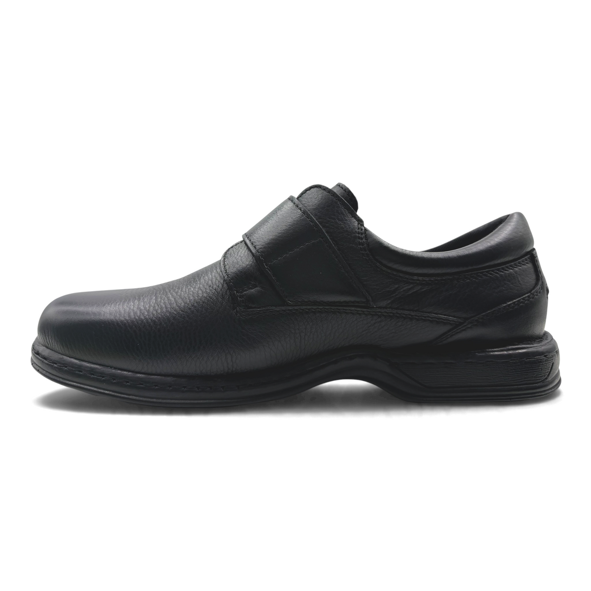 The Shoe Shop Roland black leather slip-on shoe with a hook-and-loop strap and a durable rubber sole.