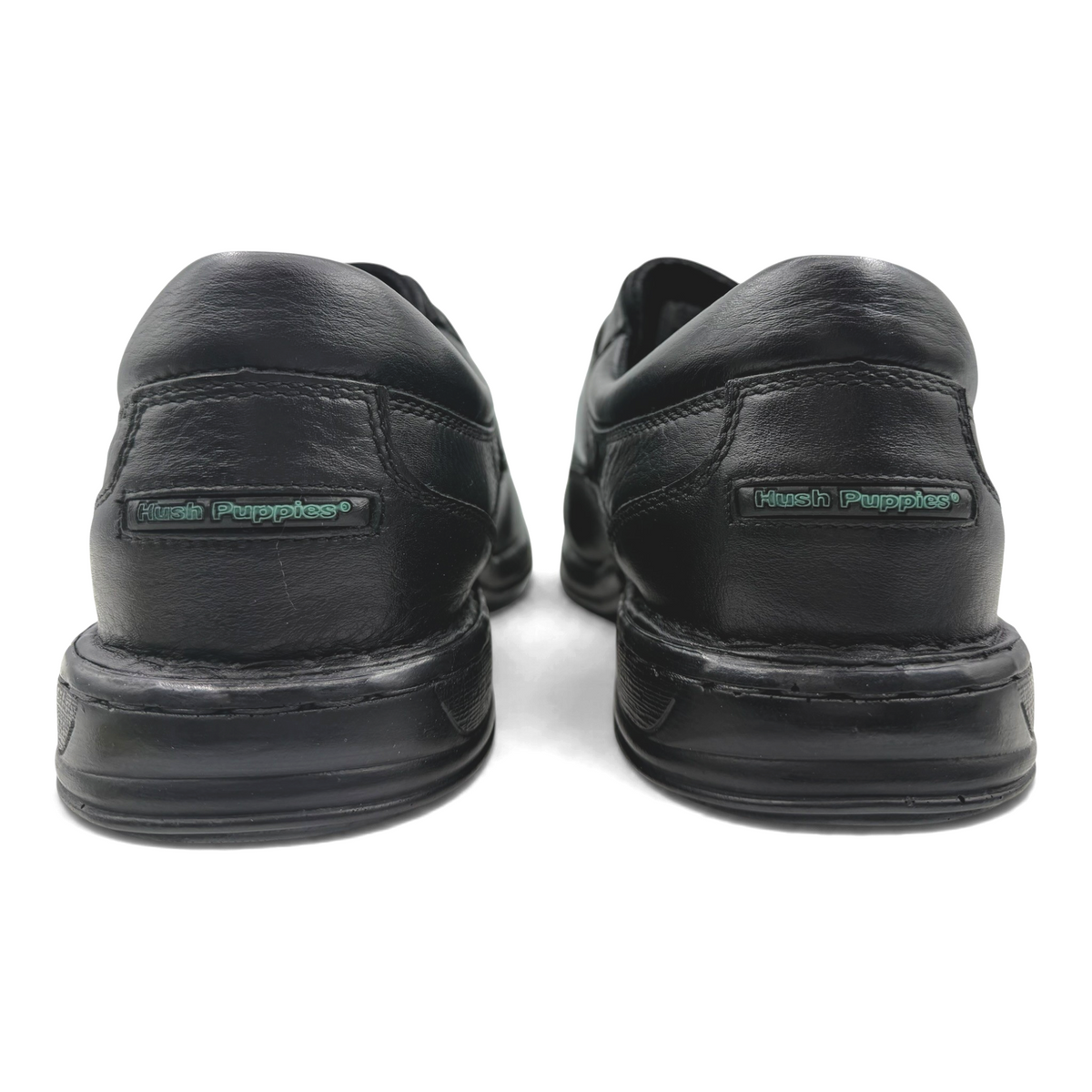 The Shoe Shop Roland black leather Hush Puppies shoes, rear view showing branded heel detail and durable soles