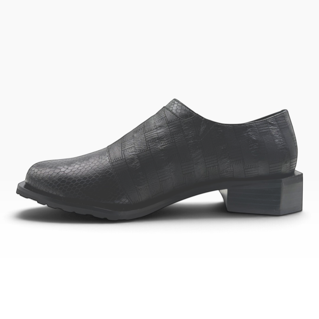 The Shoe Shop Romeo black textured leather loafer with a unique hexagonal heel and side zip detail.