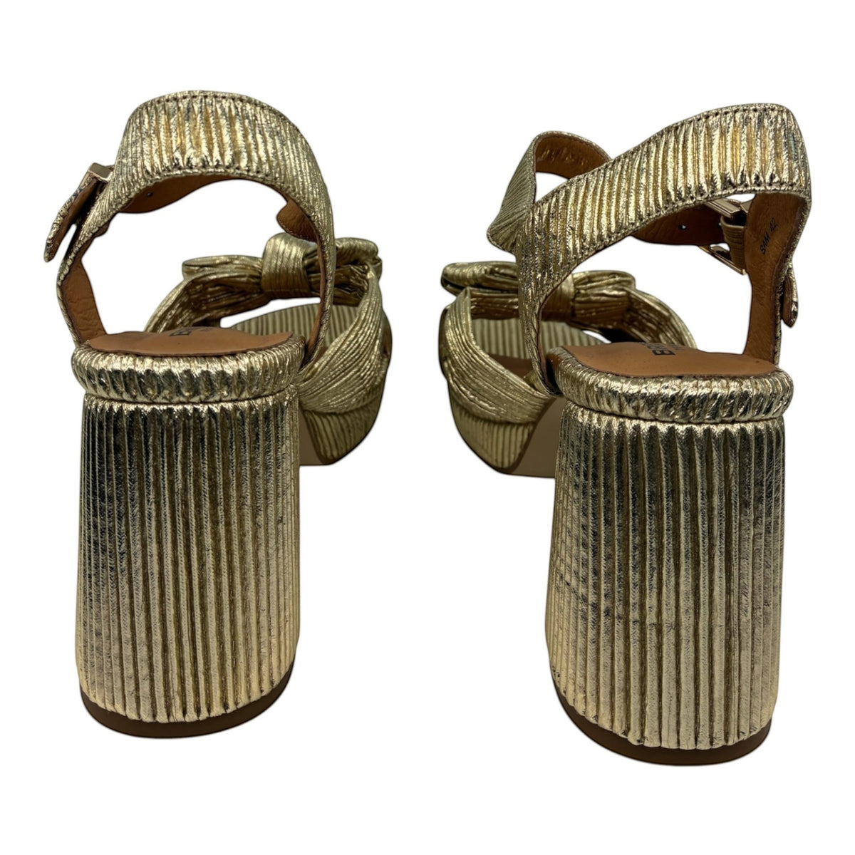 The Shoe Shop Sam gold metallic block heel sandals with a textured finish and adjustable ankle strap, rear view.