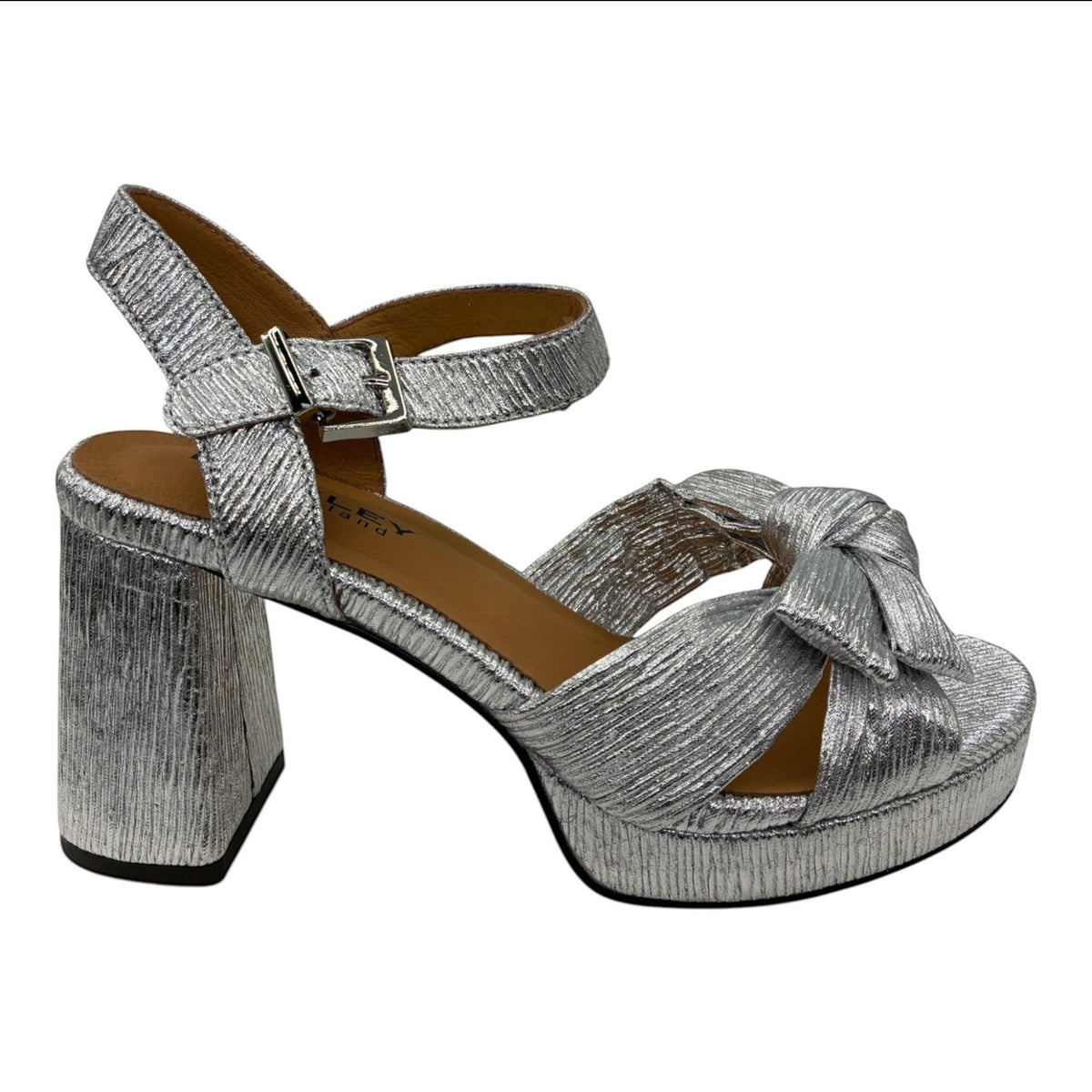 The Shoe Shop Sam silver metallic block heel sandal with a knotted bow detail and adjustable ankle strap