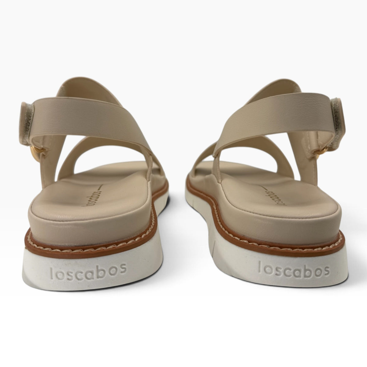 The Shoe Shop Sana wedge sandal in beige leather with an adjustable slingback strap and white lugged platform sole.