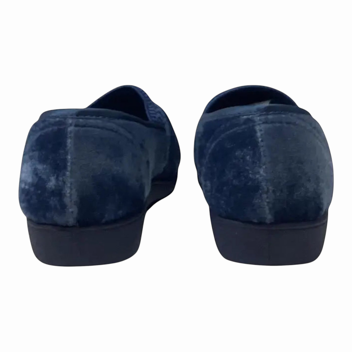 The Shoe Shop Sasha plush navy blue velvet slippers with a low-profile black sole, shown from the back view.